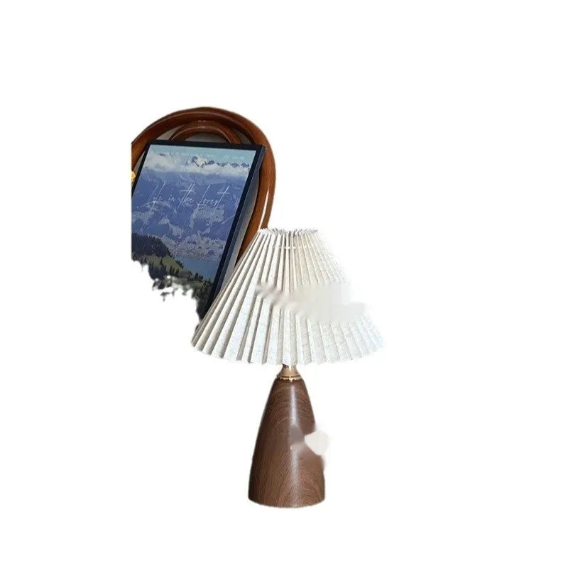 Nordic retro ceramic table lamp with a pleated tapered floral shade on a bedside table.