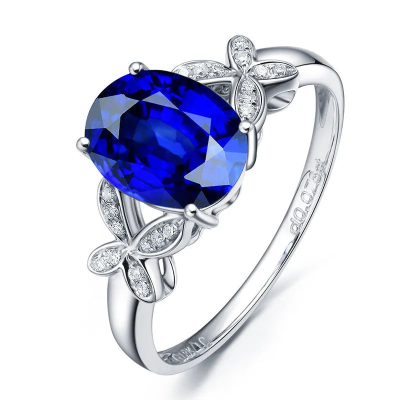 Women's heart-shaped butterfly ring in 18k rose gold plating with red or blue enamel option.
