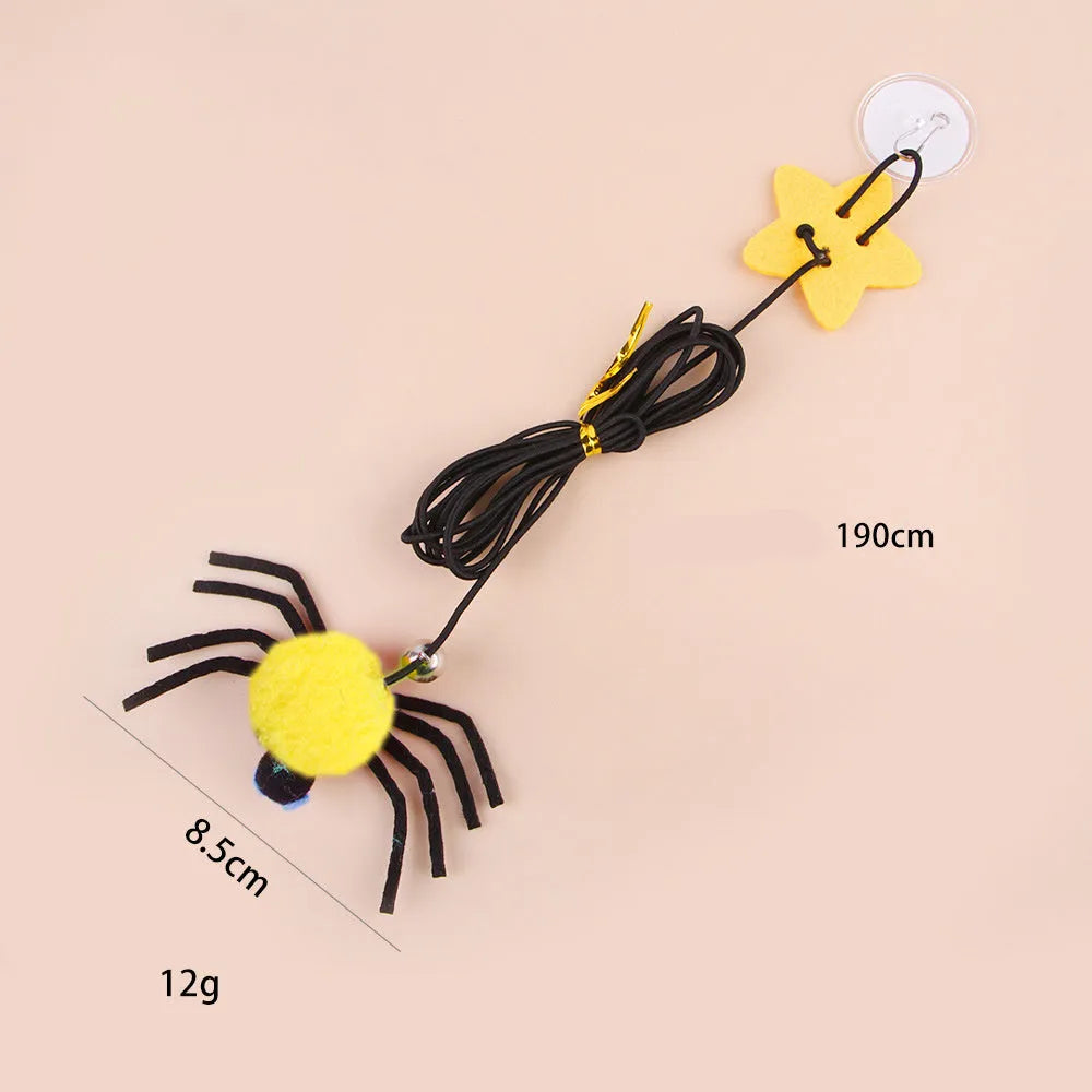Hanging door cat toy with elastic rope, feather, bell and spider attachments in red or yellow colour