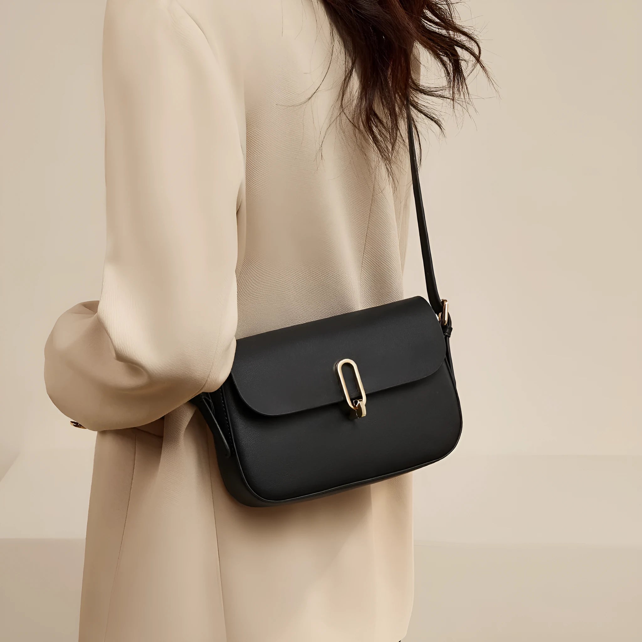 Black genuine leather square messenger bag with shoulder strap and lock closure