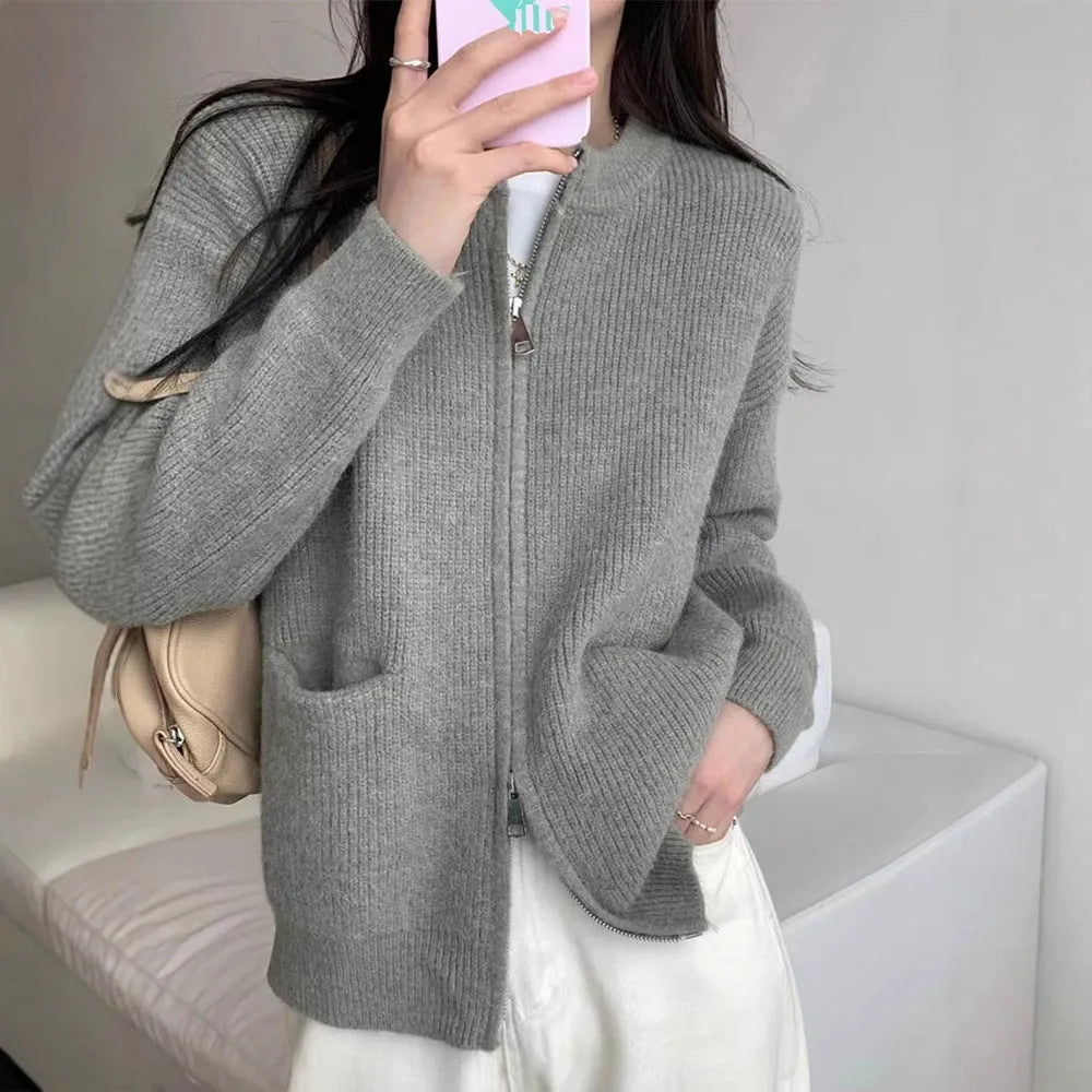 Beige women's long sleeve viscose cardigan sweater coat on a hanger