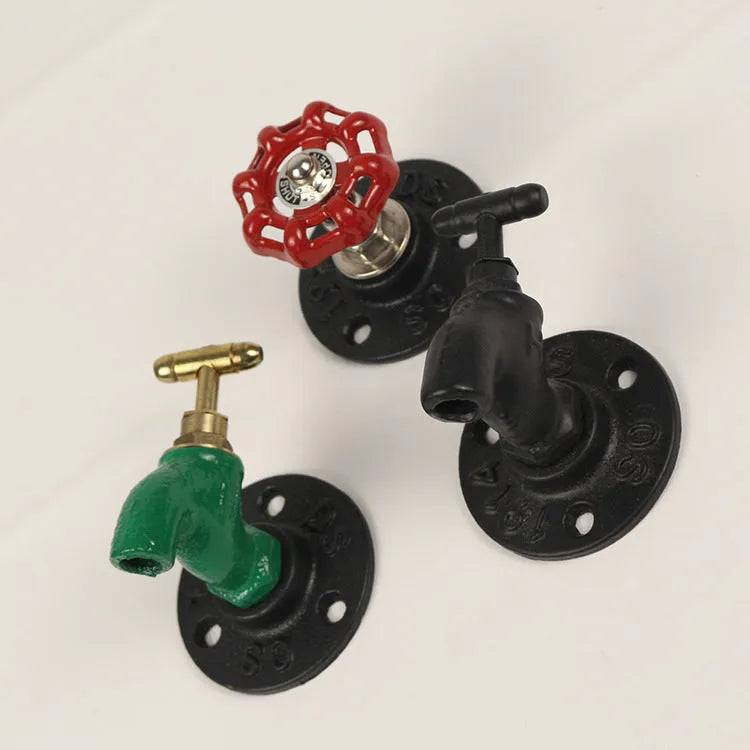 Metal water pipe style wall hanging hook in a choice of colours on a white wall.