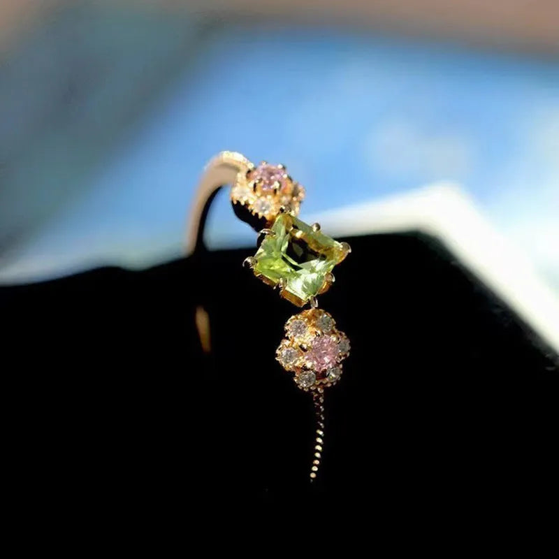 Copper geometric flower ring with Q740 gold finish on grey background, available in sizes No 6-10 for women