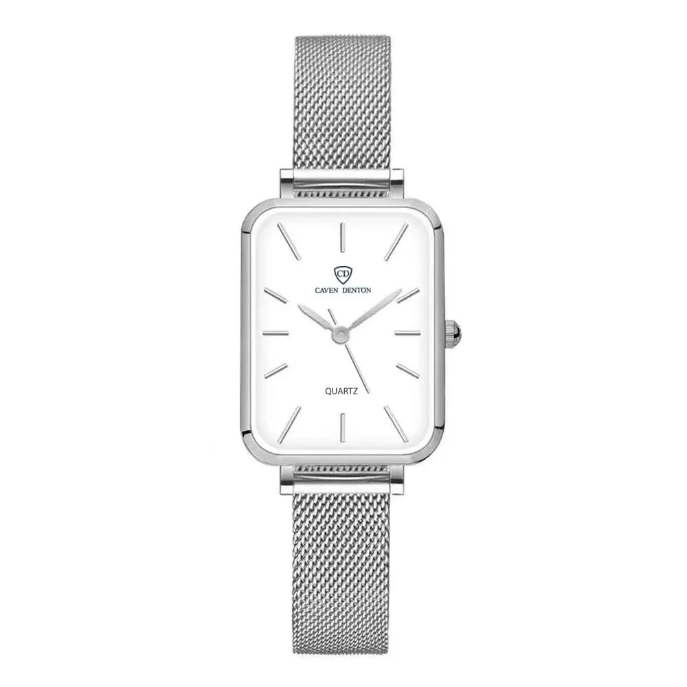 Women's rose gold waterproof quartz watch with woven steel strap on wrist.