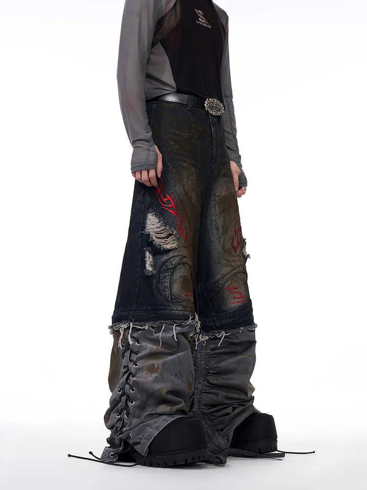 Man wearing mid-high waist wide leg denim jeans with detachable trouser legs in a picture colour.