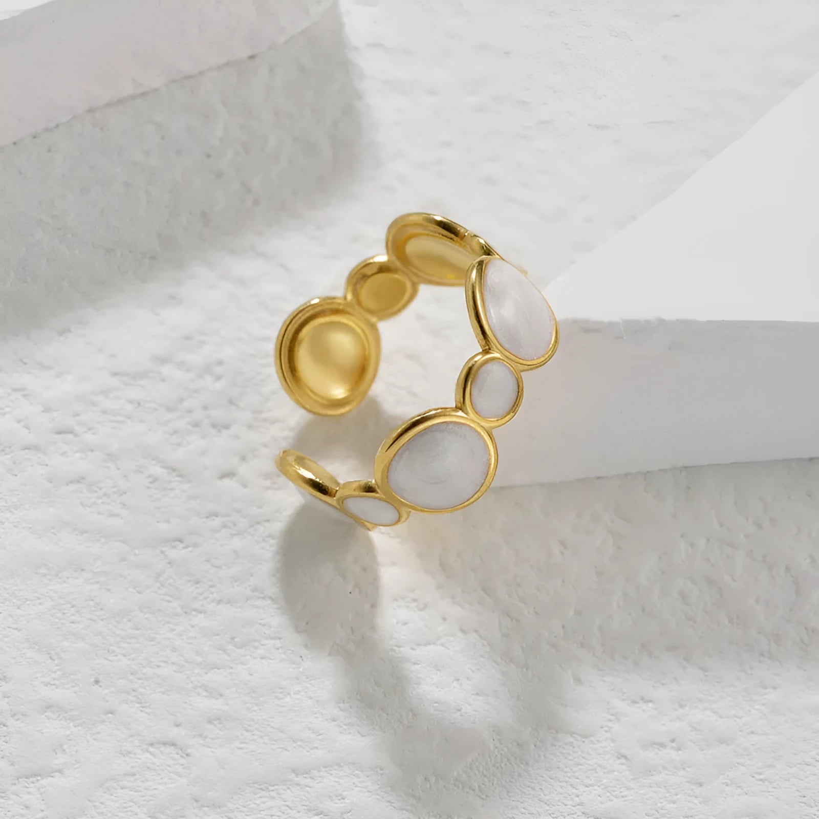 Geometric angular ring with adjustable opening in electroplated stainless steel