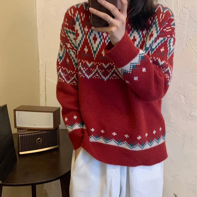 Red and white striped loose-fitting long-sleeved knitted pullover top on a model.