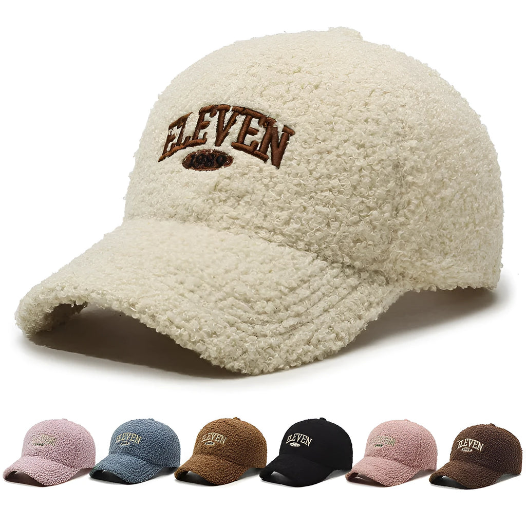 Adjustable lambskin winter baseball cap in black with dome crown and machine embroidery detail.