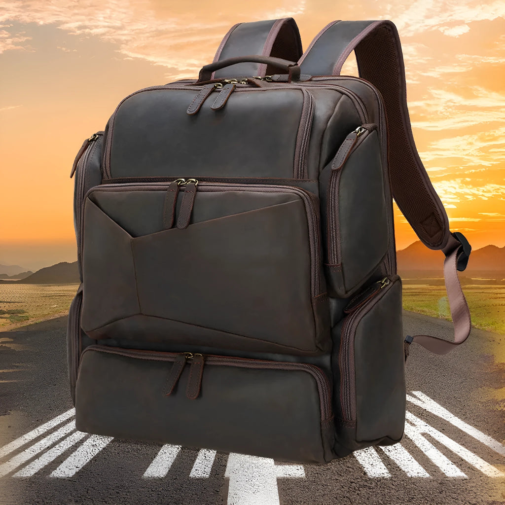 Dark brown retro crazy horse leather men's backpack showing external pockets and internal organiser for a 17-inch laptop.