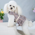 Milky white polyester dog vest harness with integrated hand-holding rope shown on a dog's chest.