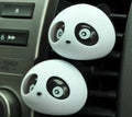 Pair of panda grain car vent perfume decorations in black and brown showing clip attachment