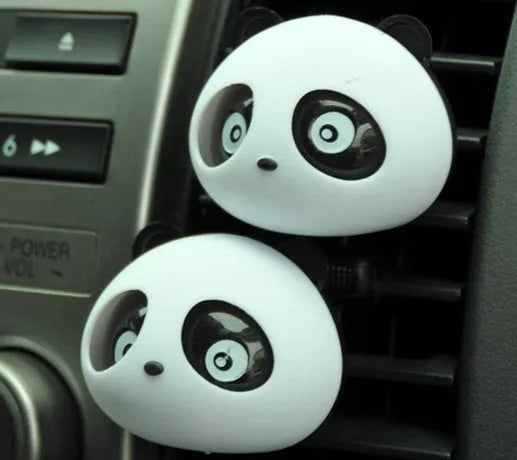 Pair of panda grain car vent perfume decorations in black and brown showing clip attachment