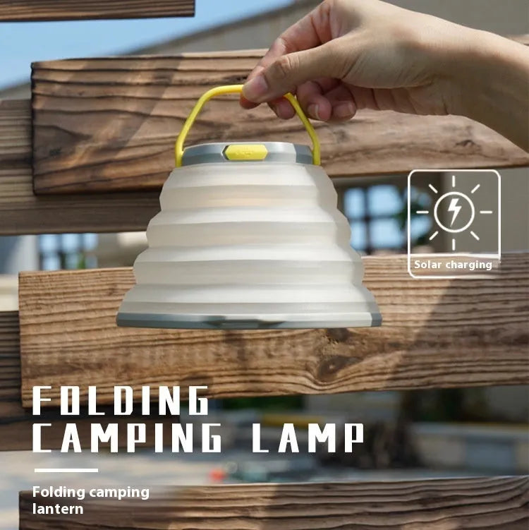 White portable camping lamp with a large light capacity and a single control button.