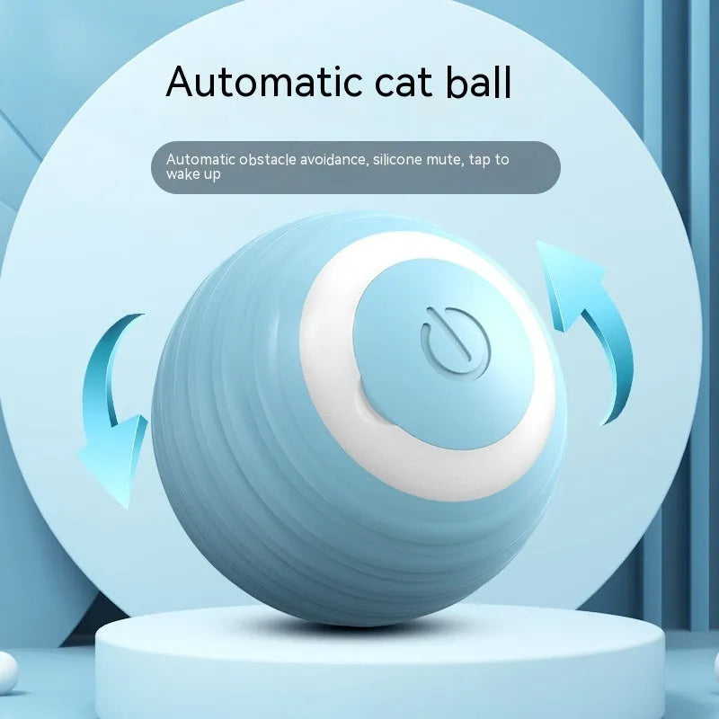 Blue and pink rechargeable automatic moving bouncing ball cat toy on a floor.