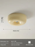 American style cream coloured bedroom ceiling light with a remote control on a white background.
