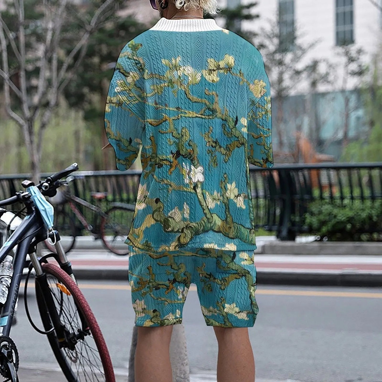 Men's peacock blue knitted shorts and T-shirt leisure suit set on a white background