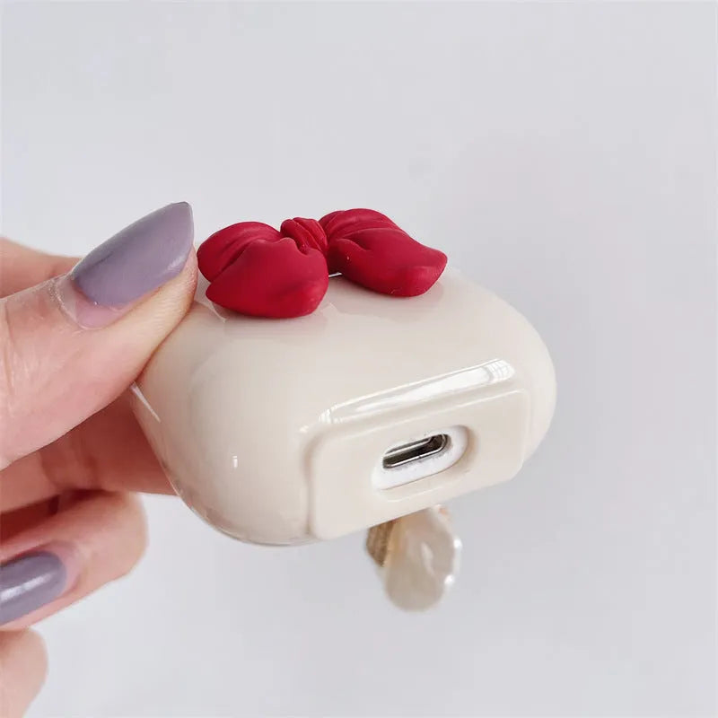 Beige TPU case with a red bow for AirPods and AirPods Pro wireless earphones
