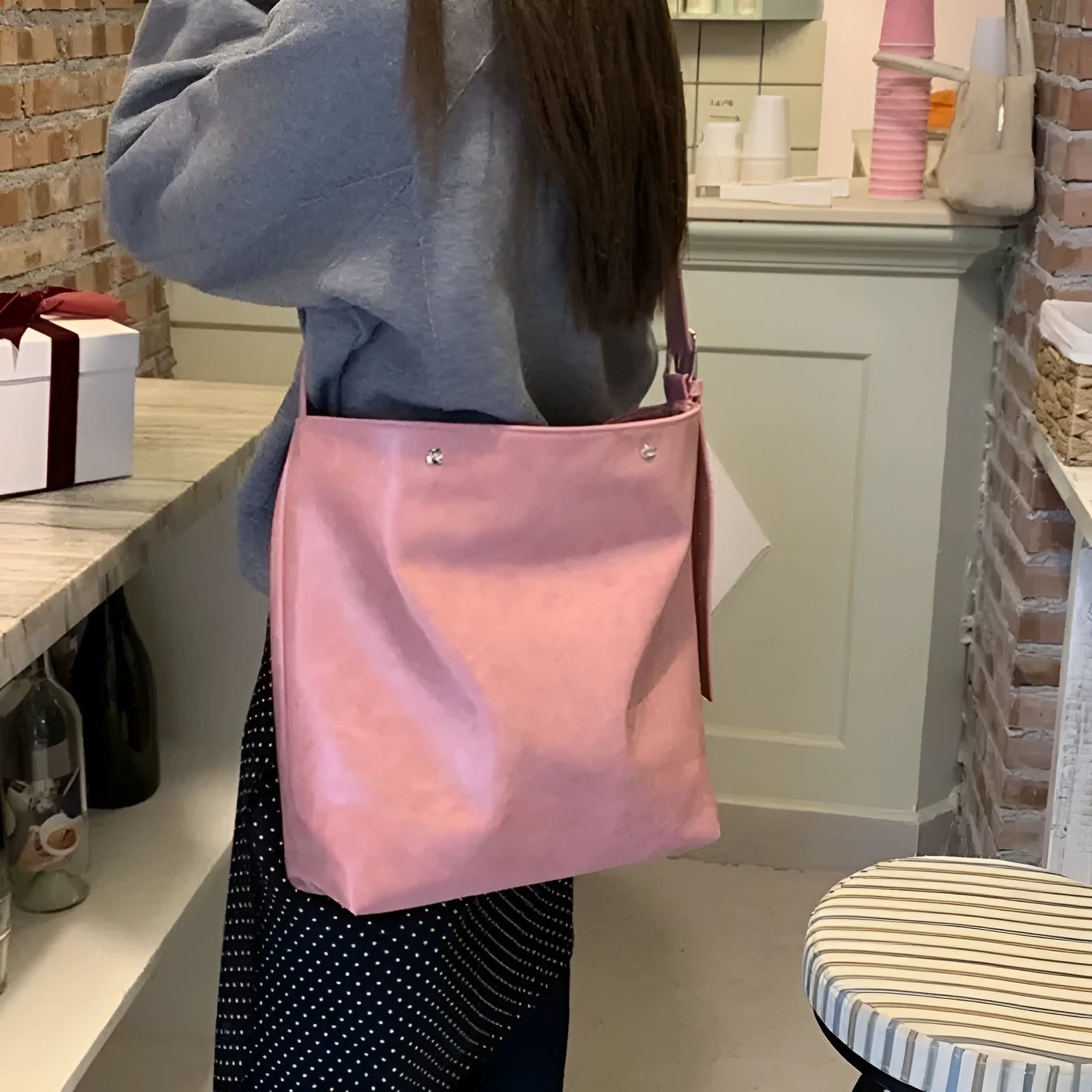 Pink corduroy one-shoulder commuter bag with dimensions 39cm by 32cm.