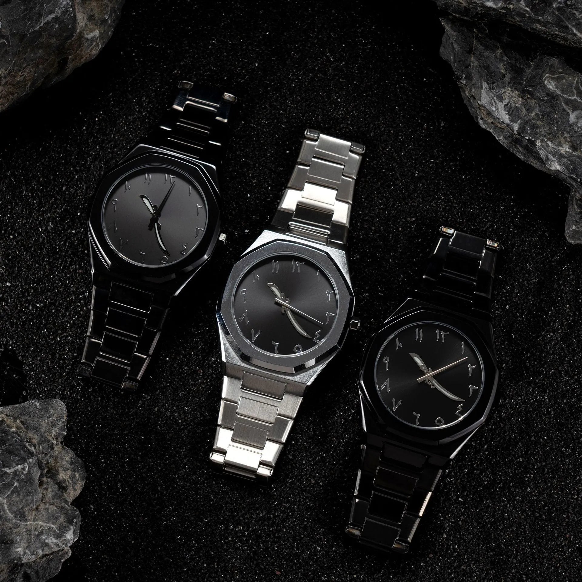 Business casual men's quartz watch with a steel belt on a wrist, showing dial colour options of black, black with silver scale, or silver with black accents.