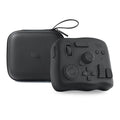 TourBox NEO video editing controller in black, showing its compact size and array of dials and buttons.