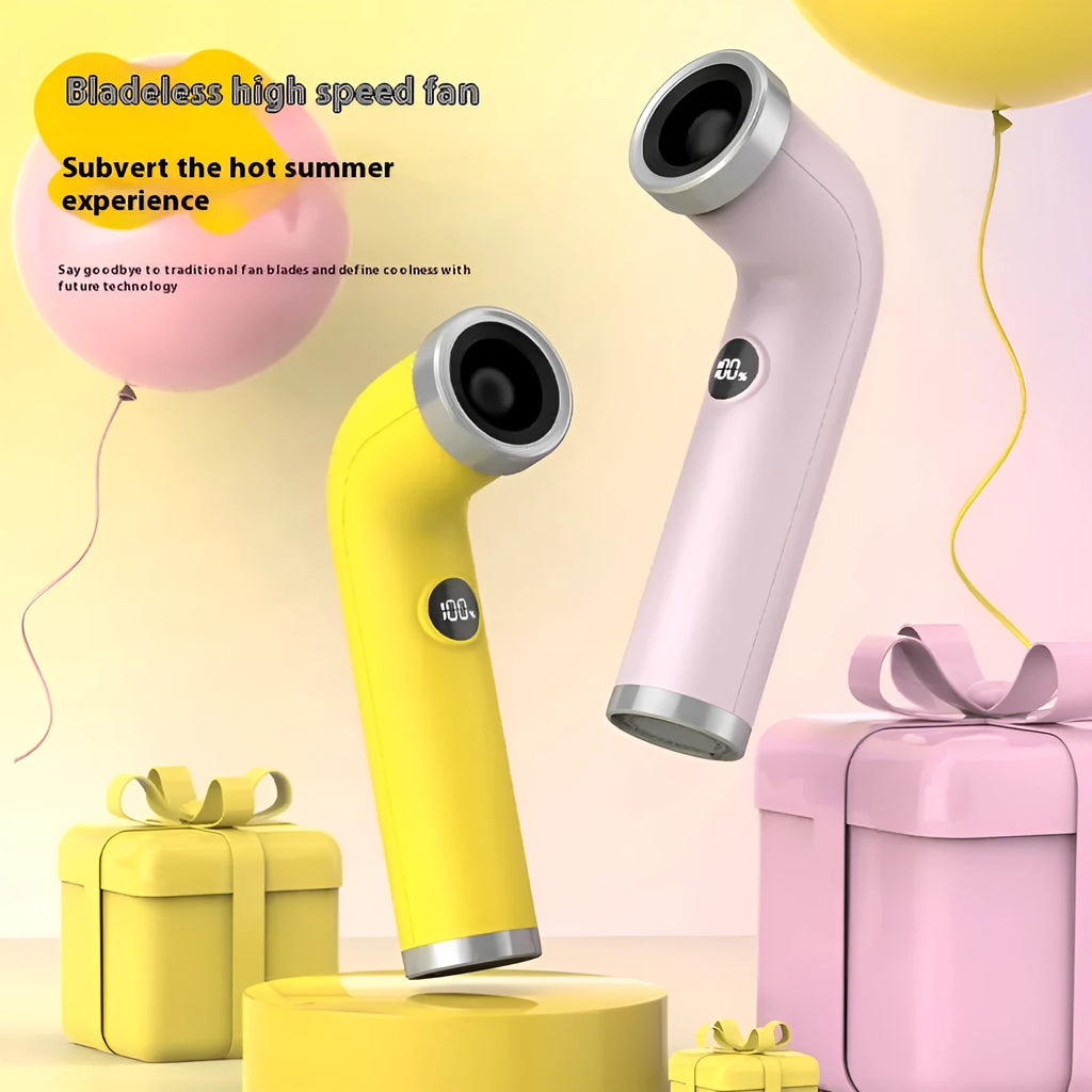 A small bladeless turbine fan in yellow colour on a desk, with a USB power cord.