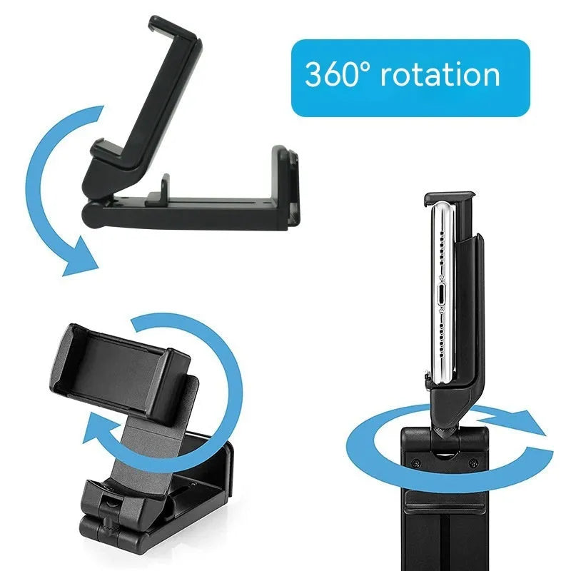 H22 Black colour 360-degree rotating collapsible mobile phone desktop holder on a wooden table.
