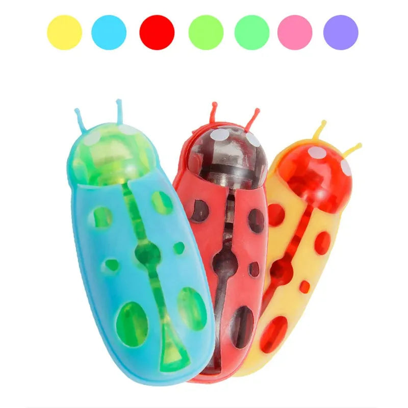 Mini electric bug cat toy with 12 angular legs in insect shape on flat surface