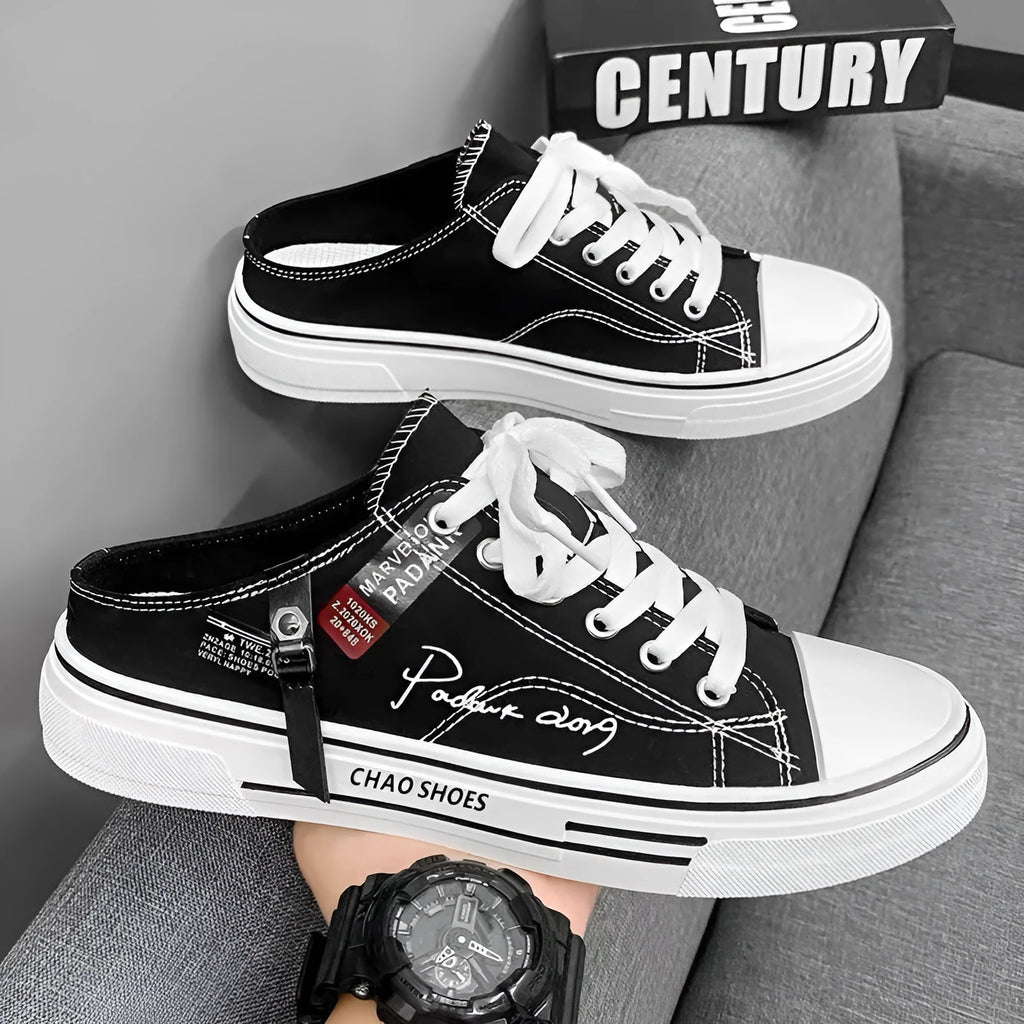 Men's canvas slip-on sports casual shoes in black with round toe design and letter pattern detail