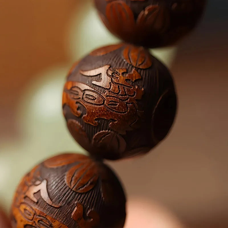 Wooden bracelet with carved Amass Fortunes character on rosewood segments