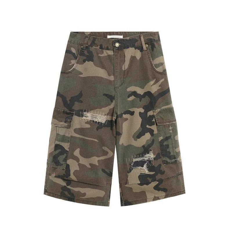 Men's loose-fit camouflage cropped jeans with ripped and patch details on a straight-leg.