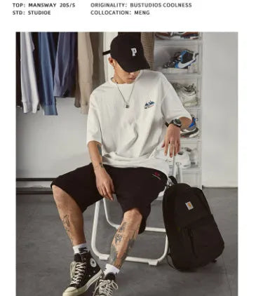 Men's black plus size loose fit short-sleeved t-shirt on a hanger
