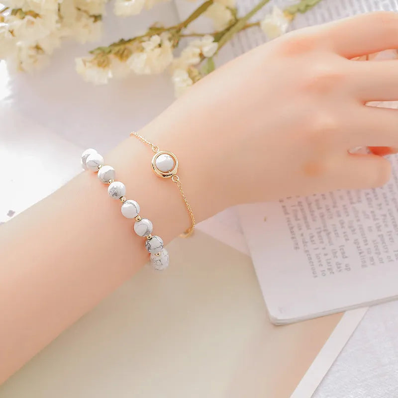 Double-layer women's bracelet with crystal beads and lucky charms in gold electroplated finish