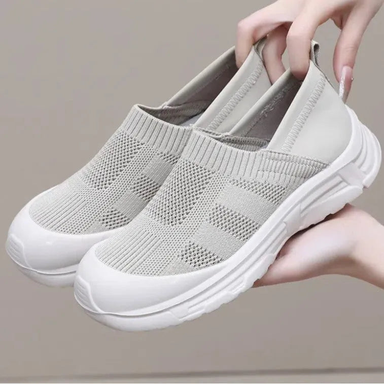 Women's slip-on casual shoes with cloth uppers and soft PVC soles in round toe design