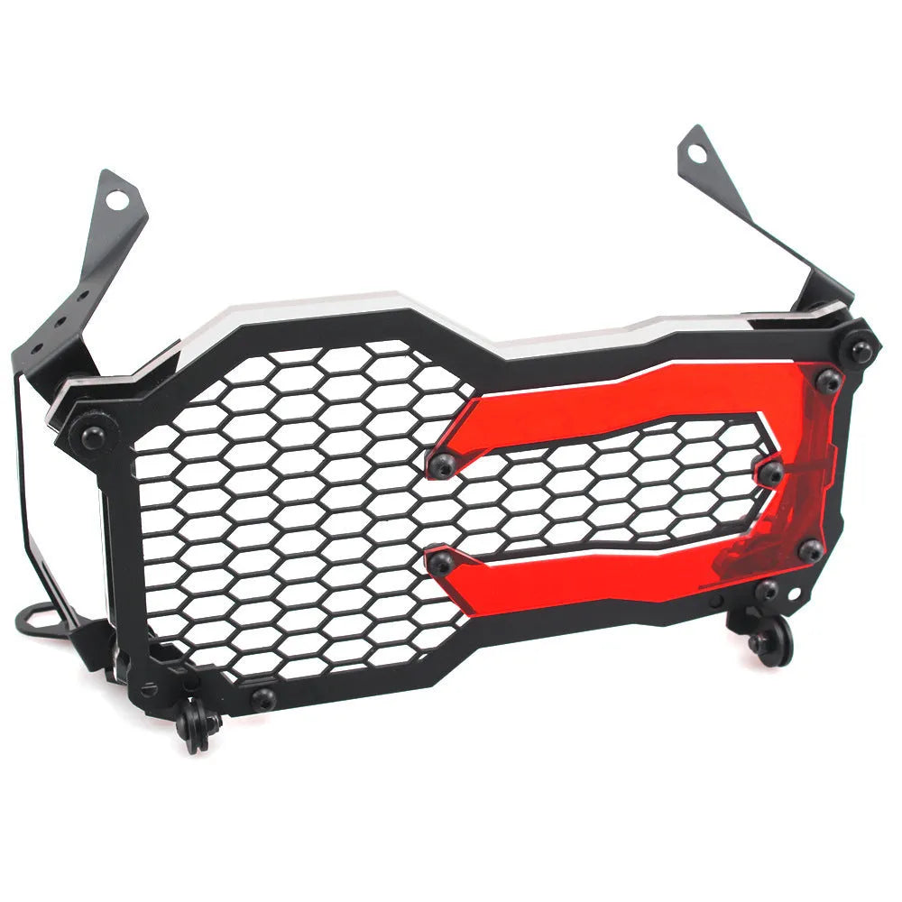 BMW motorcycle headlight protective cover in fluorescent yellow mounted on a GS adventure bike.