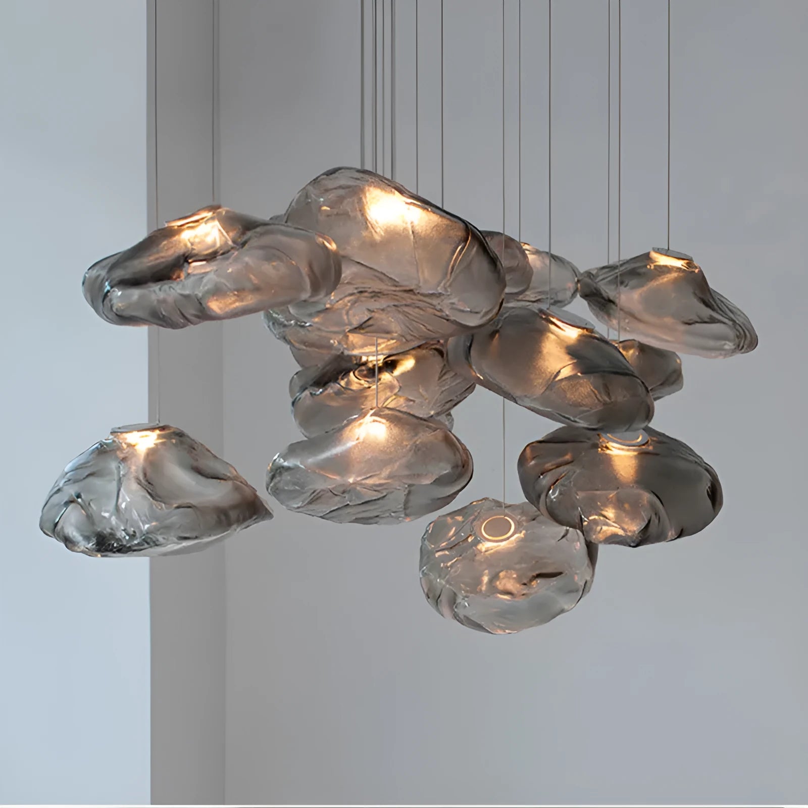 Modern glass fabric chandelier in amber, clear, or smoke grey, available in 200mm and 300mm sizes.