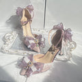Purple satin Lolita wedding shoes with a square toe and stiletto heel on a composite sole.