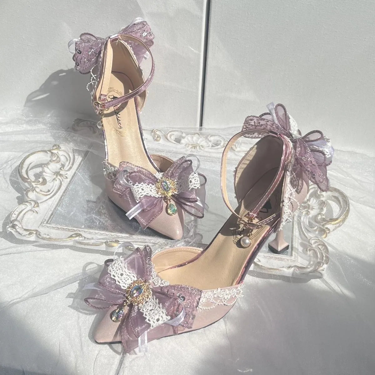Purple satin Lolita wedding shoes with a square toe and stiletto heel on a composite sole.