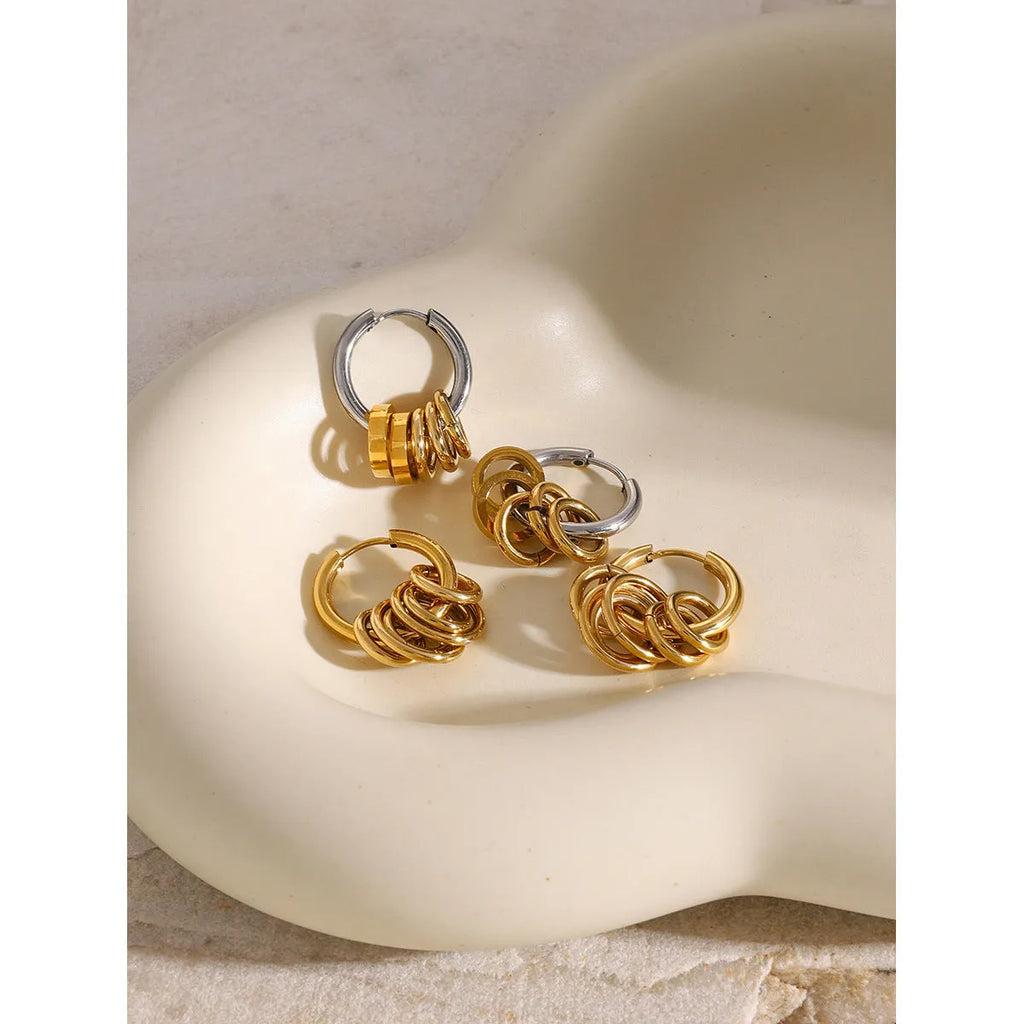 A pair of stainless steel ins style earrings with an electroplated silver or gold tone finish.