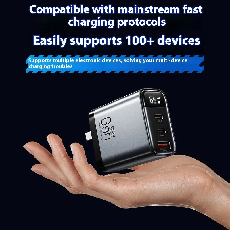 Gallium nitride three-port 65W charger with smart digital display in black, showing Type-C port