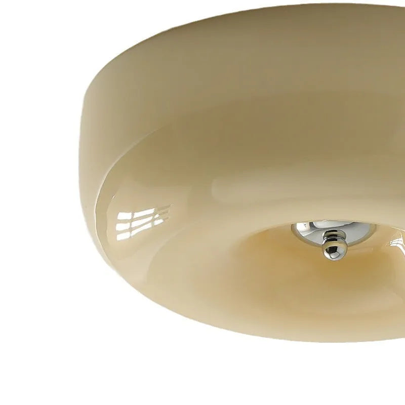 American style cream coloured bedroom ceiling light with a remote control on a white background.