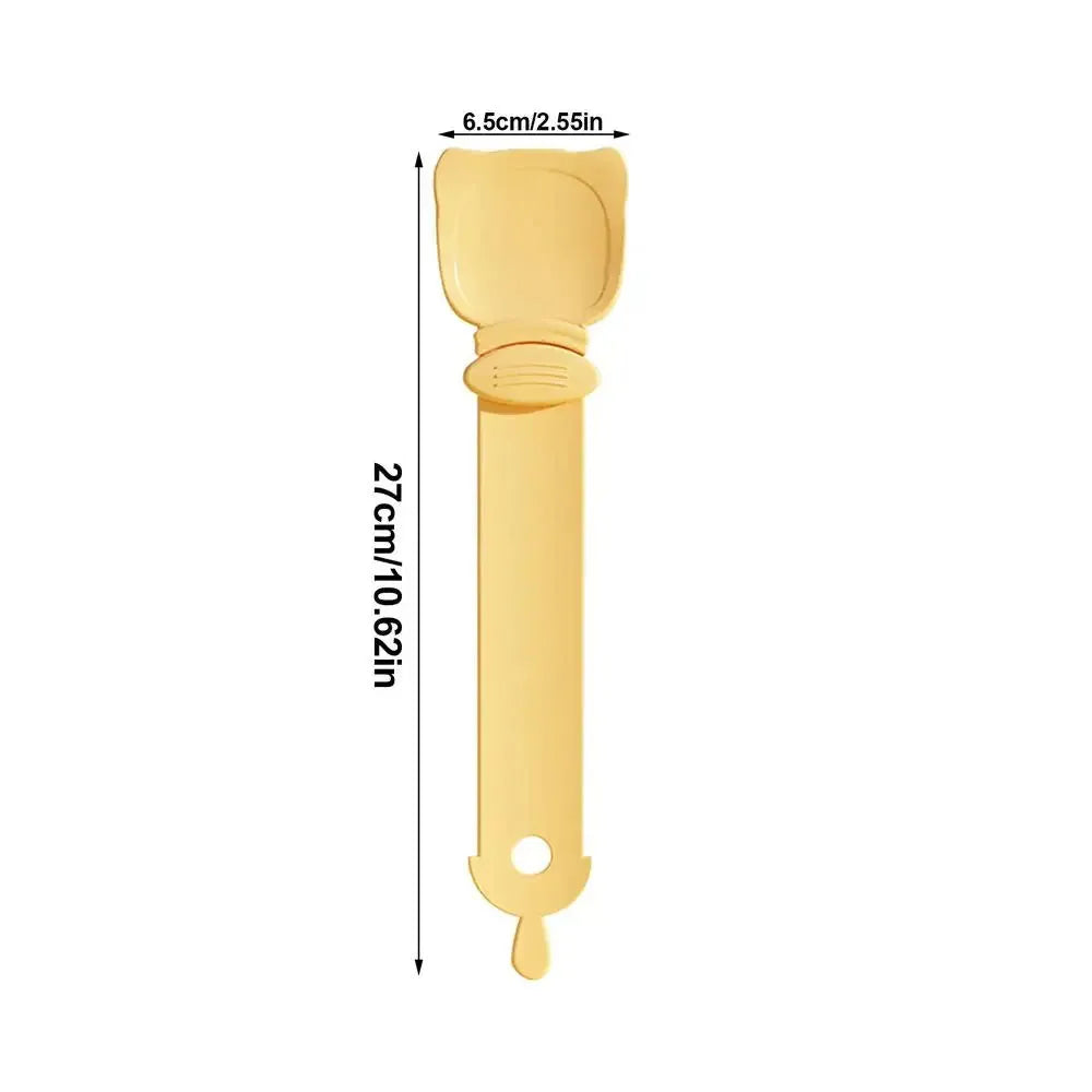 Cat Treat Spoon in green, orange, and white, measuring 27 x 6.5 cm, designed for scooping and serving cat strips