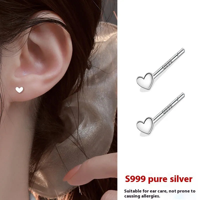 999 pure silver anti-blocking ear studs in butterfly shape on white background