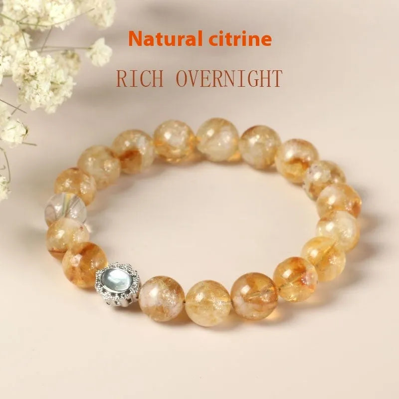 Citrine colour crystal bracelet with 10mm geometric beads on a wrist.