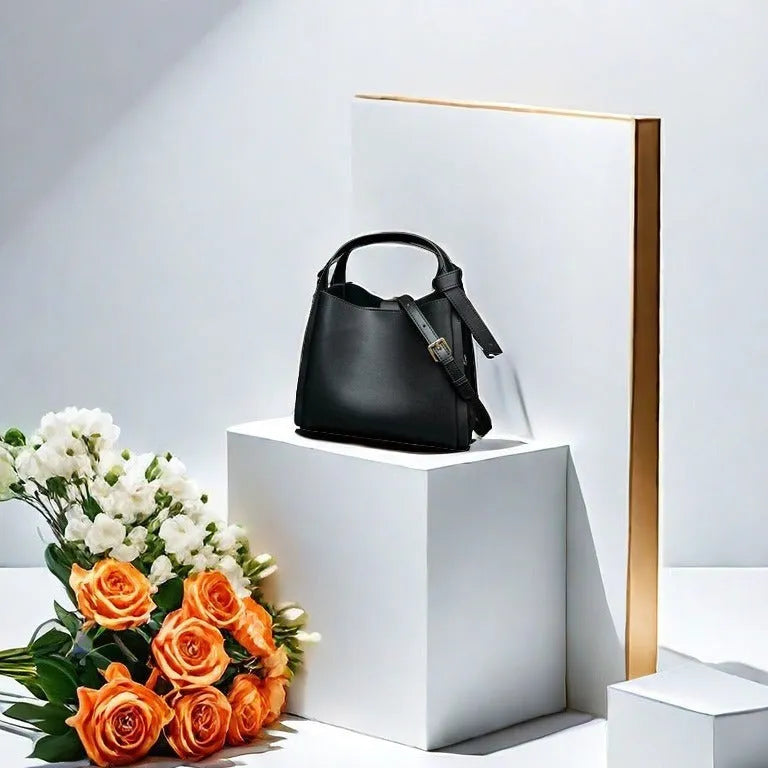 Soft cowhide leather women's crossbody bucket bag in tea brown with zippered interior pockets.