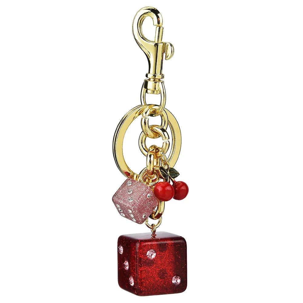 Vintage-style metal keychain with a square cherry red and white two-tone dice pendant on a metal ring.