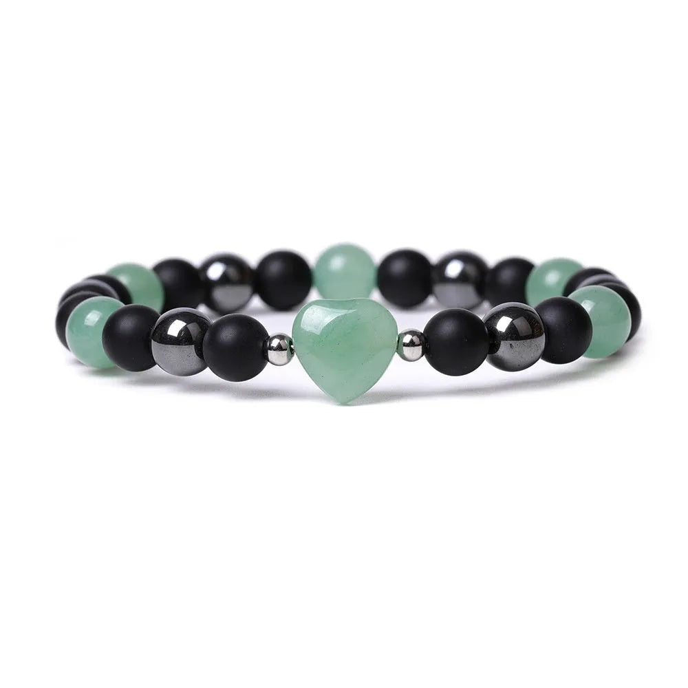 Hand-cut peach heart stone bracelet in geometric design with planetary elements