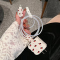 Lambskin USB cable protection sleeve in a cartoon puppy pattern, shown on a charging cable.