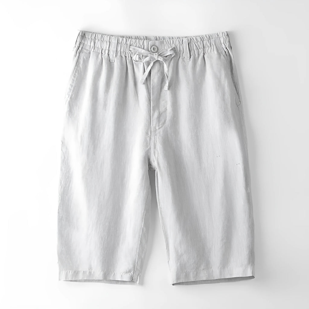 Men's linen capri trousers in loose straight-leg fit showing colour options including white, gray, black and blue tones