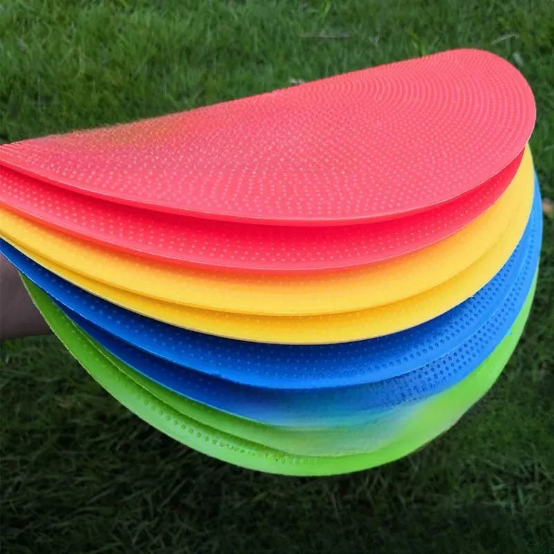 Flat circular TPE football training marker disc in bright colours for field practice.