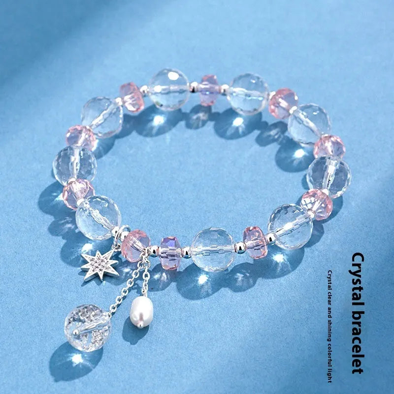 Women's white crystal bracelet with lucky cat charm and diamond-shaped stones on adjustable electroplated band
